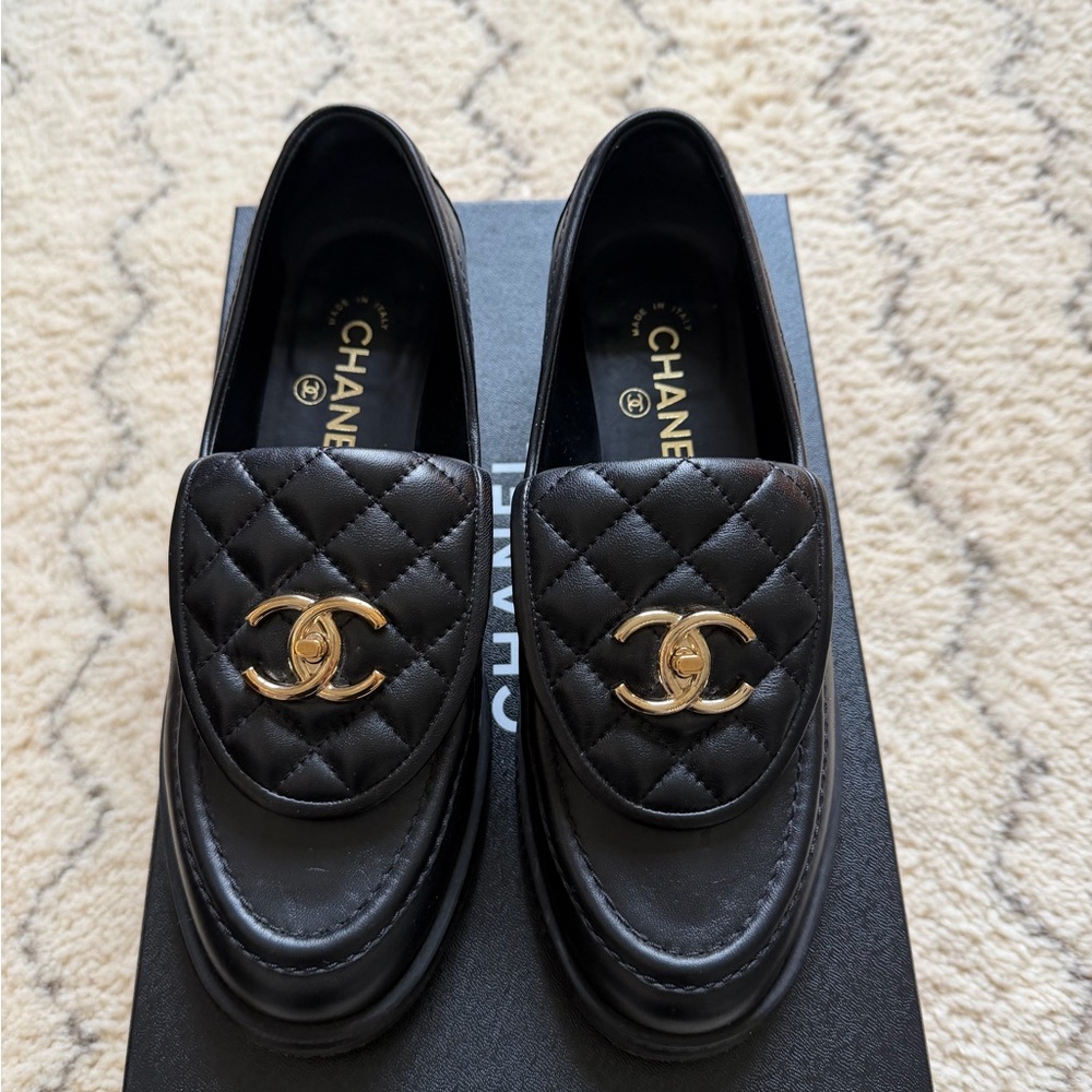 CHANEL Black and Gold Quilted Loafers
